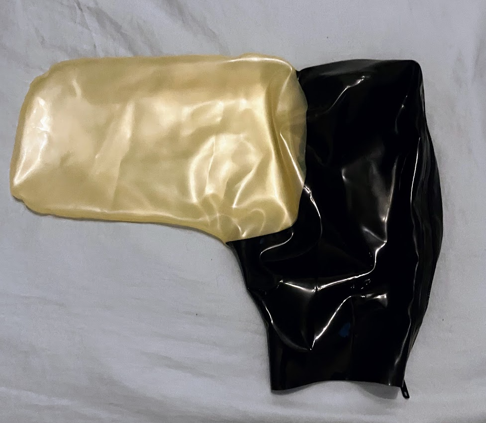 Black latex hood with attached transparent latex bag